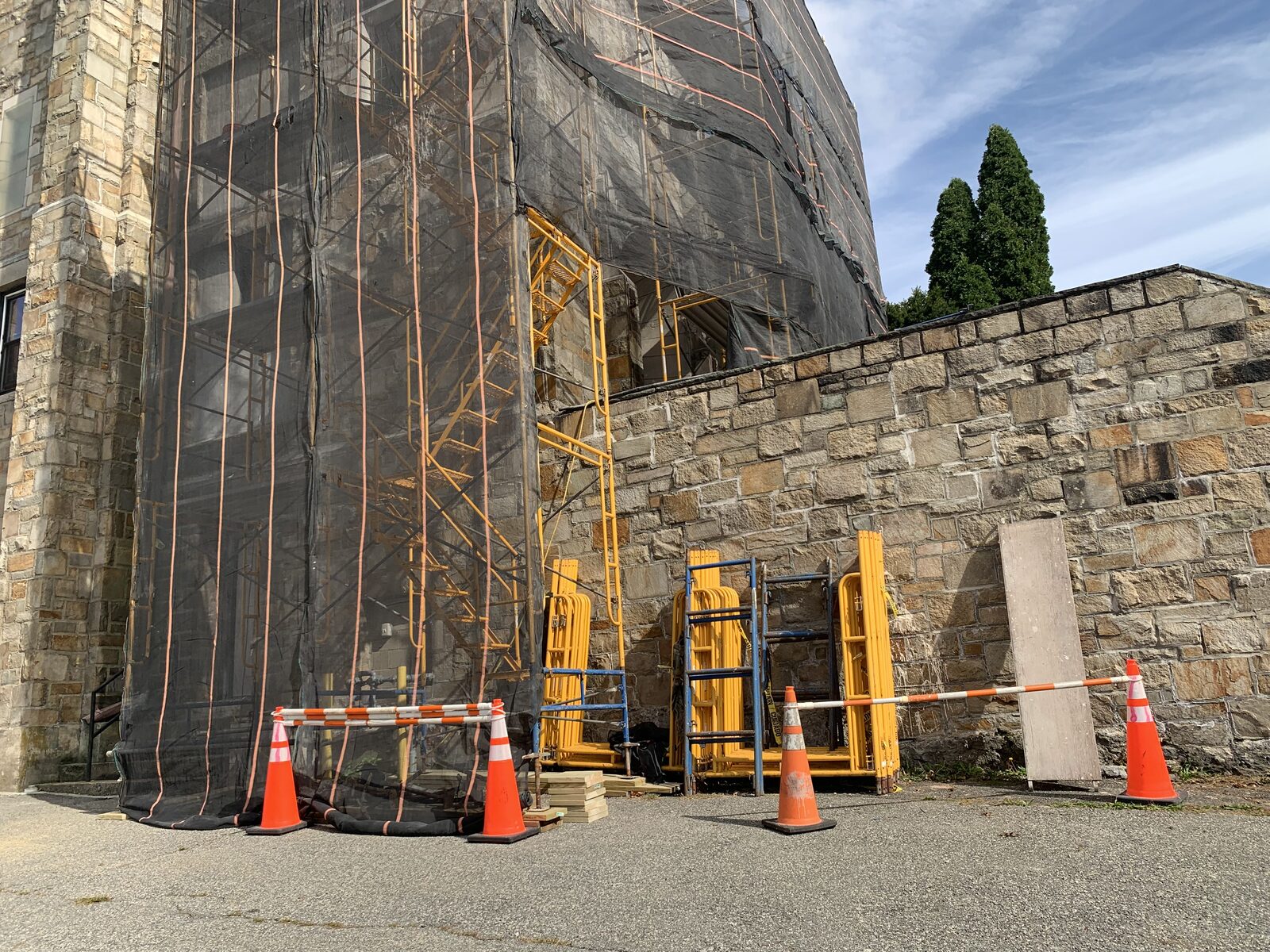 Scaffolding and safety barriers installed around the base of the historic church tower