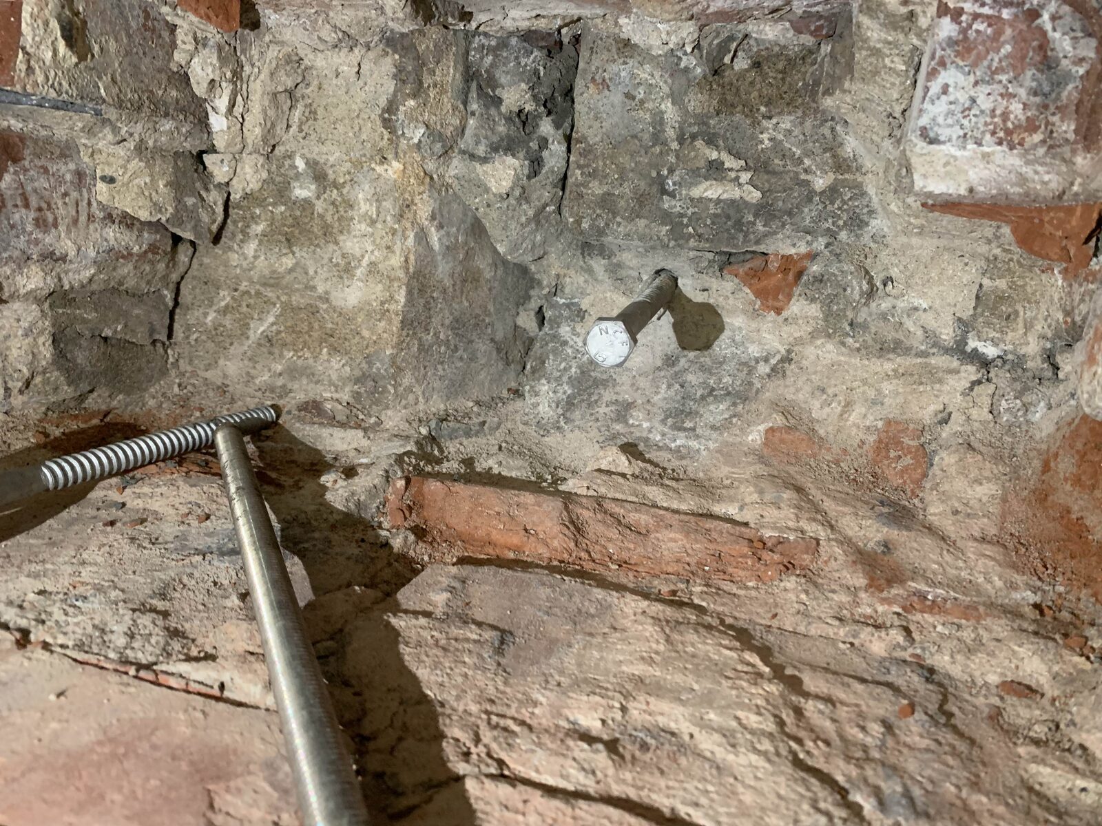 Exposed brick and stone inside the church tower during restoration work