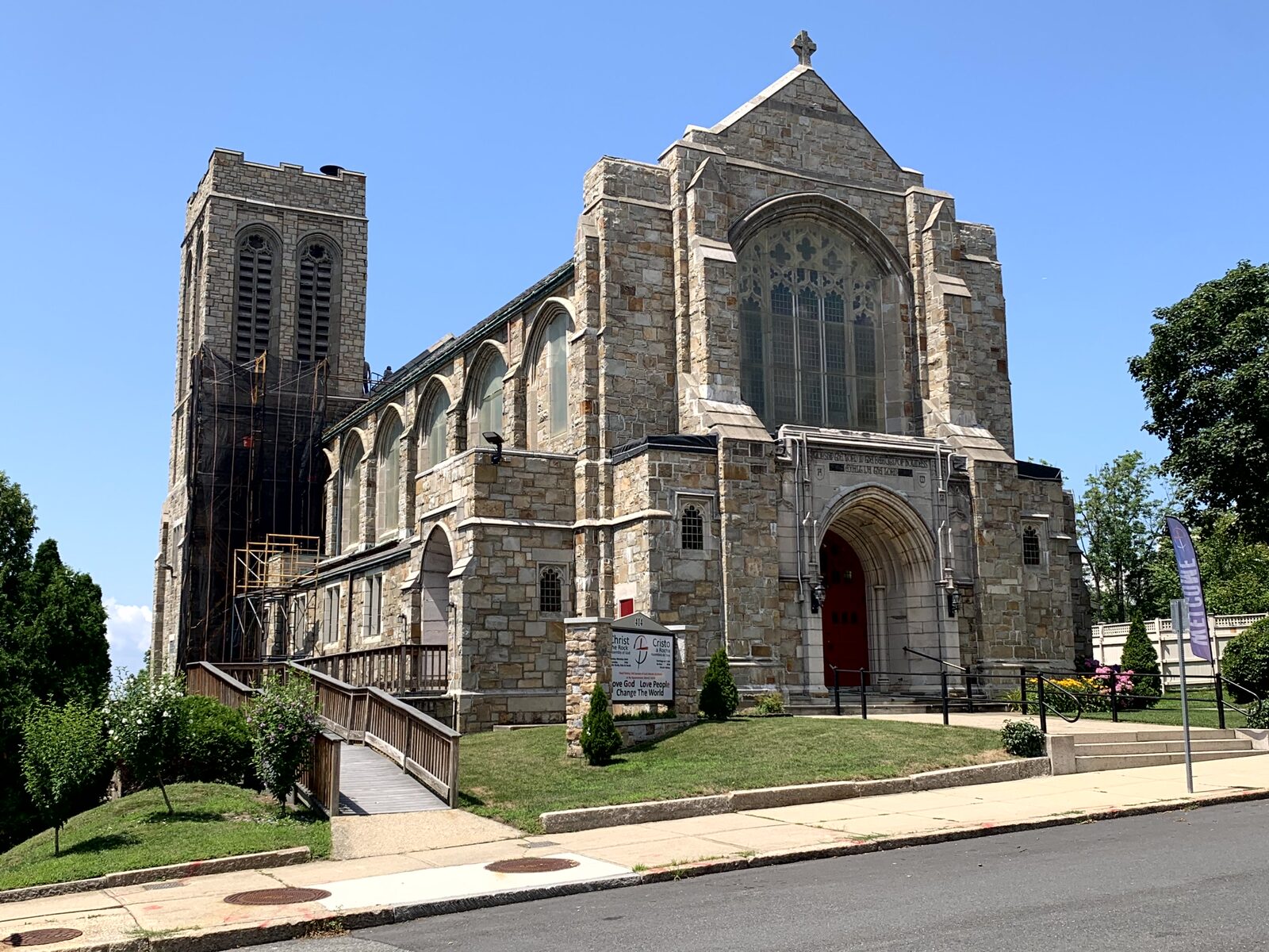 Full exterior view of Christ The Rock Church and its historic tower
