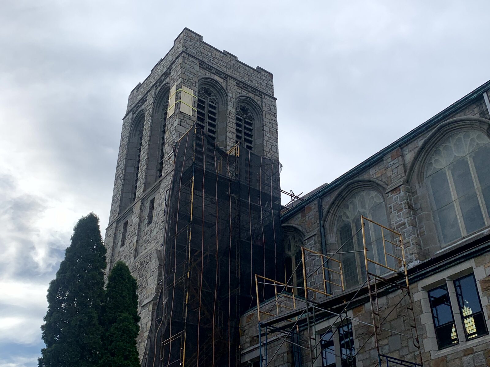 Tower restoration scaffolding and protective netting during active work
