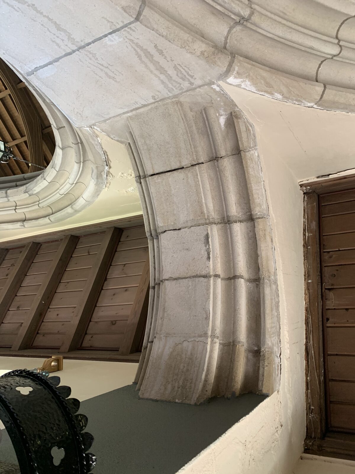 Interior stone arch and structural details inside the church tower