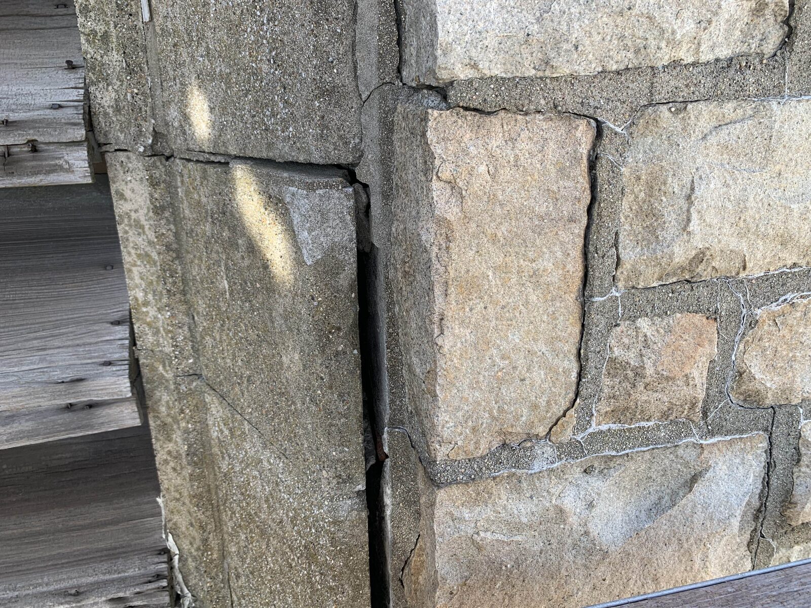 Visible separation between stone sections on the upper tower